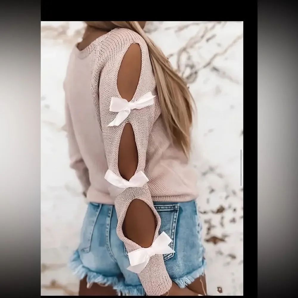 Beautiful lightweight pink sweater bow decor.Have open sleeve concept.